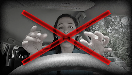 Woman burning her hands on the steering wheel